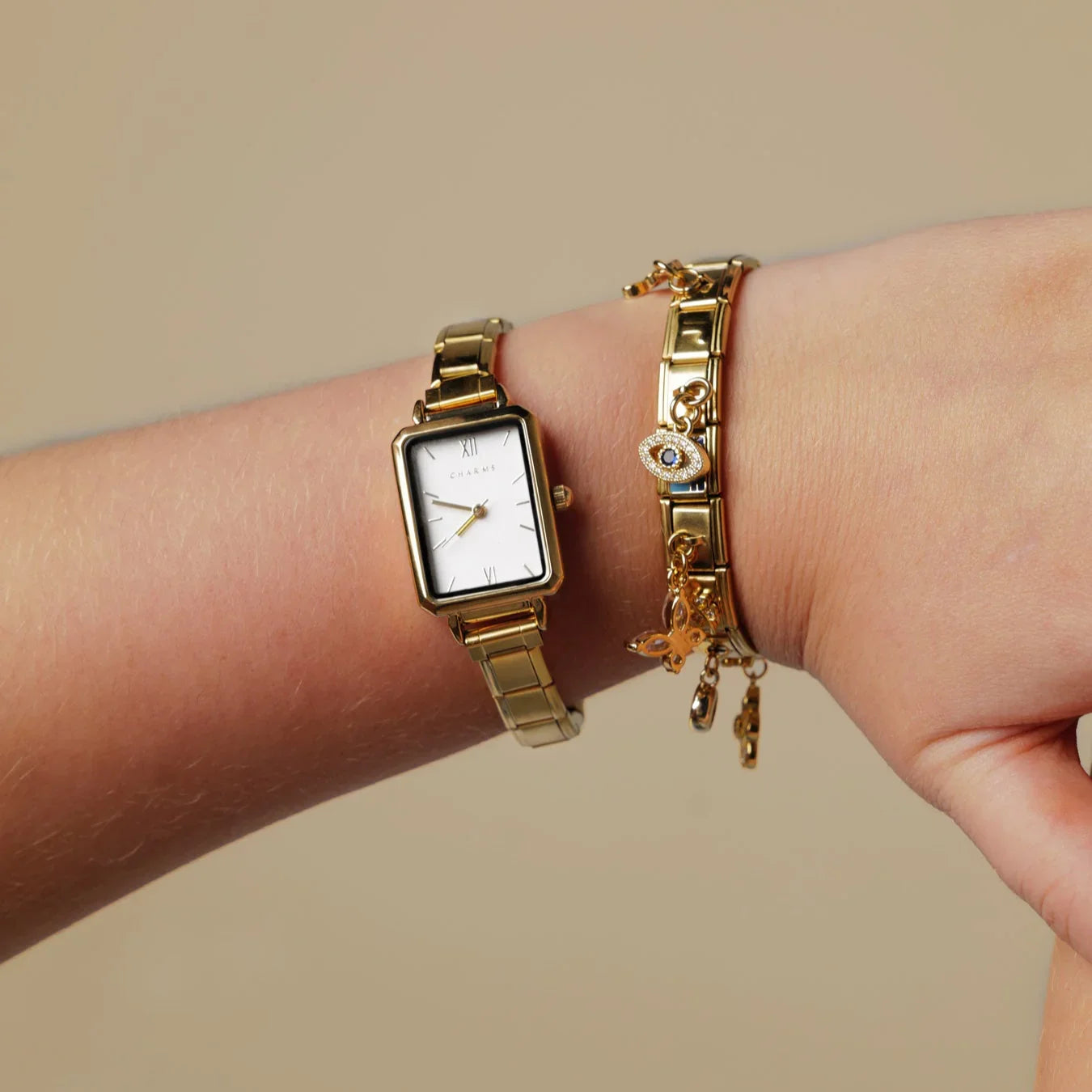 Como – Guldmodel med smaragdgrøn urskive